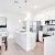 a kitchen with white cabinets