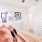 a bedroom with a bed and a mirror
