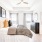 a bedroom with a bed and a fan