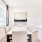 a dining room with a table and chairs