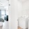 a room with a bed and a washing machine