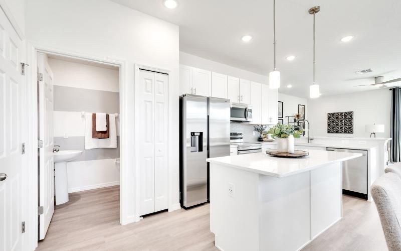 a kitchen with white cabinets