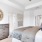 a bedroom with a large mirror