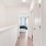 a hallway with white walls