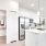 a kitchen with white cabinets